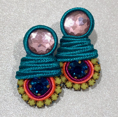 The Ceciel Amy Earrings create an eye-catching look.  Looks great wether you dress it up or just wear it with a simple t-shirt. Earrings made with ​​the intricate soutache technique embroidery. They will come in a gift box.  Handmade with so much love and care using high quality materials. Unique piece. Swarovski crystals and silk tussel. Back is 14K Gold to avoid allergies. Lightweight