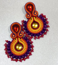 Load image into Gallery viewer, The Ceciel Daisy Earrings create an eye-catching look.  Looks great wether you dress it up or just wear it with a simple t-shirt. Earrings made with ​​the intricate soutache technique embroidery. They will come in a gift box.  Handmade with so much love and care using high quality materials. Unique piece. Swarovski crystals and silk tussel. Back is 14K Gold to avoid allergies. Lightweight
