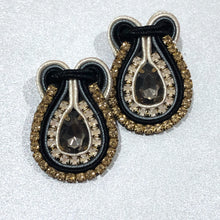 Load image into Gallery viewer, The Ceciel Kate Earrings create an eye-catching look.  Looks great wether you dress it up or just wear it with a simple t-shirt. Earrings made with ​​the intricate soutache technique embroidery. They will come in a gift box.  Handmade with so much love and care using high quality materials. Unique piece. Swarovski crystals and silk tussel. Back is 14K Gold to avoid allergies. Lightweight
