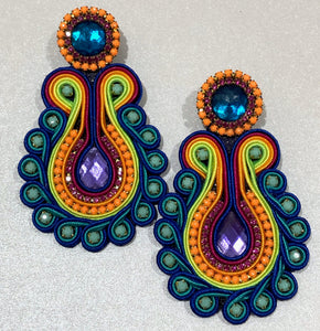 The Ceciel Lola Earrings create an eye-catching look.  Looks great wether you dress it up or just wear it with a simple t-shirt. Earrings made with ​​the intricate soutache technique embroidery. They will come in a gift box.  Handmade with so much love and care using high quality materials. Unique piece. Swarovski crystals and silk tussel. Back is 14K Gold to avoid allergies. Lightweight