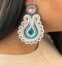 Load image into Gallery viewer, The Ceciel Lola Earrings create an eye-catching look.  Looks great wether you dress it up or just wear it with a simple t-shirt. Earrings made with ​​the intricate soutache technique embroidery. They will come in a gift box.  Handmade with so much love and care using high quality materials. Unique piece. Swarovski crystals and silk tussel. Back is 14K Gold to avoid allergies. Lightweight
