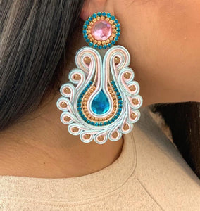 The Ceciel Lola Earrings create an eye-catching look.  Looks great wether you dress it up or just wear it with a simple t-shirt. Earrings made with ​​the intricate soutache technique embroidery. They will come in a gift box.  Handmade with so much love and care using high quality materials. Unique piece. Swarovski crystals and silk tussel. Back is 14K Gold to avoid allergies. Lightweight