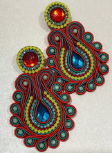 Load image into Gallery viewer, The Ceciel Lola Earrings create an eye-catching look.  Looks great wether you dress it up or just wear it with a simple t-shirt. Earrings made with ​​the intricate soutache technique embroidery. They will come in a gift box.  Handmade with so much love and care using high quality materials. Unique piece. Swarovski crystals and silk tussel. Back is 14K Gold to avoid allergies. Lightweight
