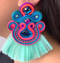 Load image into Gallery viewer, The Ceciel Macarena Earrings create an eye-catching look.  Looks great wether you dress it up or just wear it with a simple t-shirt. Earrings made with ​​the intricate soutache technique embroidery. They will come in a gift box.  Handmade with so much love and care using high quality materials. Unique piece. Swarovski crystals and silk tussel. Back is 14K Gold to avoid allergies. Lightweight
