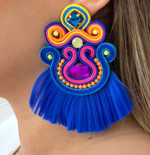 Load image into Gallery viewer, The Ceciel Macarena Earrings create an eye-catching look.  Looks great wether you dress it up or just wear it with a simple t-shirt. Earrings made with ​​the intricate soutache technique embroidery. They will come in a gift box.  Handmade with so much love and care using high quality materials. Unique piece. Swarovski crystals and silk tussel. Back is 14K Gold to avoid allergies. Lightweight
