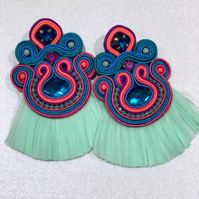 Load image into Gallery viewer, The Ceciel Macarena Earrings create an eye-catching look.  Looks great wether you dress it up or just wear it with a simple t-shirt. Earrings made with ​​the intricate soutache technique embroidery. They will come in a gift box.  Handmade with so much love and care using high quality materials. Unique piece. Swarovski crystals and silk tussel. Back is 14K Gold to avoid allergies. Lightweight
