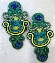 Load image into Gallery viewer, The Ceciel Mia Earrings create an eye-catching look.  Looks great wether you dress it up or just wear it with a simple t-shirt. Earrings made with ​​the intricate soutache technique embroidery. They will come in a gift box.  Handmade with so much love and care using high quality materials. Unique piece. Swarovski crystals and silk tussel. Back is 14K Gold to avoid allergies. Lightweight
