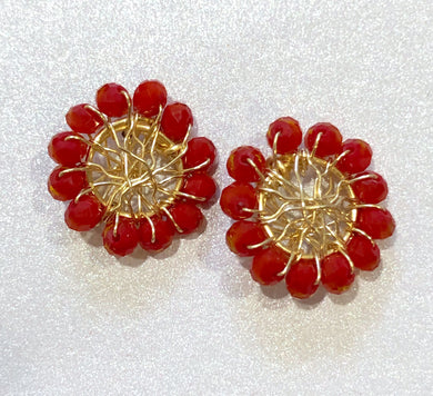 The Ceciel Ruby Earrings create an eye-catching look.  Looks great wether you dress it up or just wear it with a simple t-shirt. They will come in a gift box.  Gold Chic Collection.  Handmade with so much love and care using high quality materials. Unique piece. Swarovski crystals Back is 14K Gold to avoid allergies. Lightweight Gold wire wrap